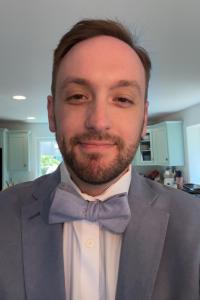 Photo of a bearded man wearing a bowtie